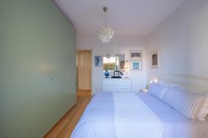 Ένα ή περισσότερα κρεβάτια σε δωμάτιο στο Bambagioni 14 - Smart Flat con Garage Privato - ItalyWeGo