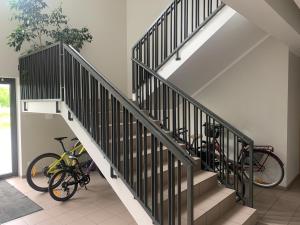 two bikes are parked next to a staircase at Merikotka apartment in Kuressaare