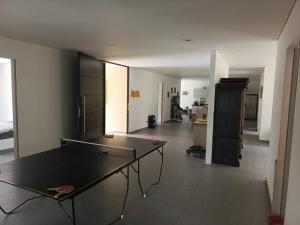 a living room with a ping pong table in it at CASA QUINTA BELLO HORIZONTE in La Mesa