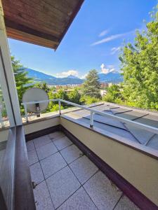 a balcony with a view of a basketball hoop at Innsbruck Nature & City House I Free Parking in Innsbruck