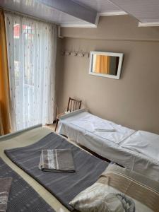 A bed or beds in a room at Vakho house