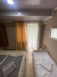 A bed or beds in a room at Vakho house
