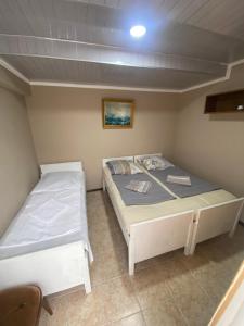 A bed or beds in a room at Vakho house