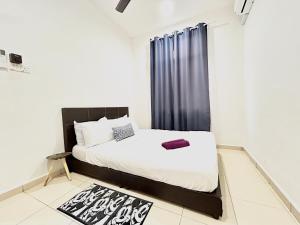 a bedroom with a bed and a black curtain at Cozy 288 Entire 3 bedroom House @ Alma Bukit Mertajam in Bukit Mertajam