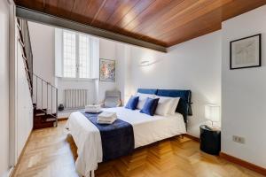 Letto o letti in una camera di Casa Valentina - Oasi di tranquillità e stile a Testaccio