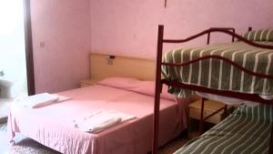 Ένα ή περισσότερα κρεβάτια σε δωμάτιο στο Hotel Cinzia