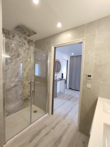 a bathroom with a shower and a sink at Appartement proche mer, climatisé, netflix in Argelès-sur-Mer +27 photos