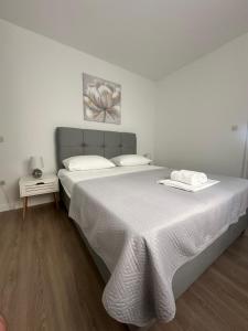 Postel nebo postele na pokoji v ubytování Seaside apartments Polić, Rogoznica