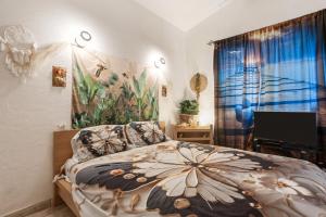 Katil atau katil-katil dalam bilik di Palmiers en couleurs +19 gambar
