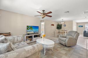 a living room with a couch and a table at Little Slice in Cape Coral