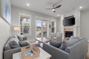 a living room with two couches and a fireplace at Miramar Beach Villas 112 by Newman-Dailey in Destin