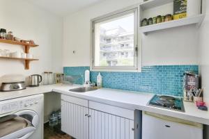 Kuchyň nebo kuchyňský kout v ubytování Confort et Calme Appart 2 personnes