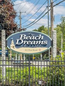a sign for a beach dreamsauts poet road at Sweet Beach Retreat home in Wells