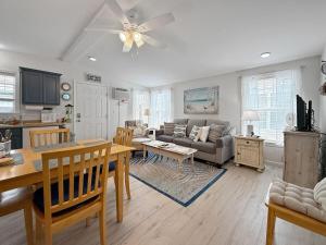 a living room with a couch and a table at Sweet Beach Retreat home in Wells +16 photos