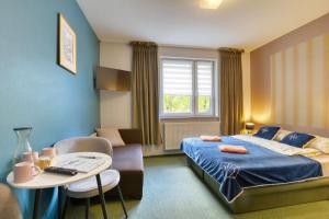 Ένα ή περισσότερα κρεβάτια σε δωμάτιο στο Harmont Montis- dawna Zającówka- IDEALNA lokalizacja - leśna enklawa w centrum miasta! Sauna, masaże, zabiegi spa! +55 φωτογραφίες