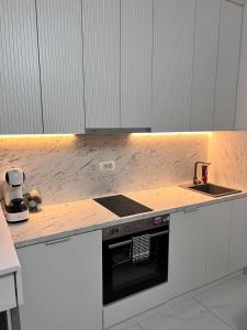 Η κουζίνα ή μικρή κουζίνα στο Blue Haven apartments +6 φωτογραφίες