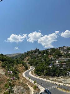a road on the side of a hill at Albanian Oasis in Gjirokastër