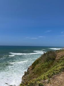 a view of the ocean from a beach at Ericeira - Casa Tia Alice in Ericeira