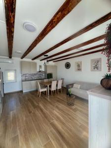 a living room with a couch and a table at Vranac Country house Šibenik in Donje Polje