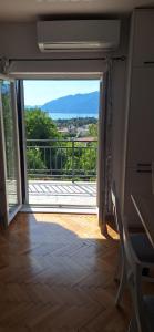 an open door to a balcony with a view at Apartman Nadja2 in Tivat