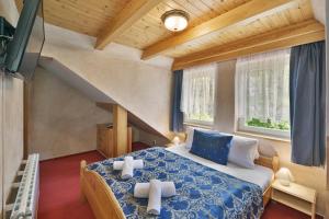 Posteľ alebo postele v izbe v ubytovaní Hotel Resort Martin & Kristyna