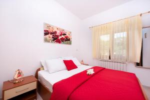 Ένα ή περισσότερα κρεβάτια σε δωμάτιο στο Apartman Roko