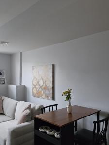 a living room with a couch and a table at Springfield Kensington in Saskatoon