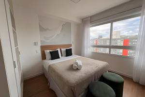 Postel nebo postele na pokoji v ubytování Cond Connect Puc + 164 fotografií