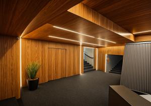 a hallway with wooden walls and a staircase with a potted plant at MD House Express in Passo Fundo