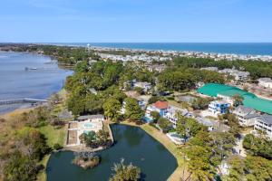 an aerial view of a home on the shore of a lake at Beachaholic in Corolla