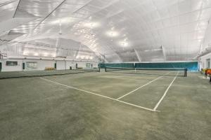 an indoor tennis court with a tennis at Beachaholic in Corolla