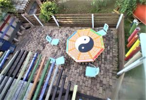 an overhead view of an umbrella and a table at Casa di Tatiana in Senigallia +2 photos