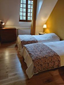 Postel nebo postele na pokoji v ubytování Moulin du 17 ème à 10 min de Brantôme en Périgord
