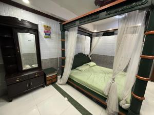 Postel nebo postele na pokoji v ubytování Esakki Palace