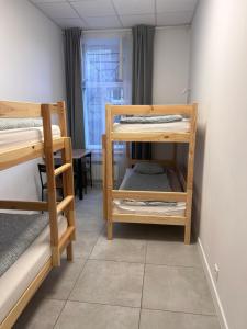 Postel nebo postele na pokoji v ubytování Golden Hostel