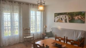 a living room with a couch and a table at Mirador de la Campiña in Cazorla