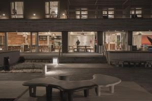 a building with a bench in the middle of a room at Rayentray Puerto Piramides in Puerto Pirámides