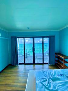 Postel nebo postele na pokoji v ubytování Aloha Mabul Scuba Lodge + 10 fotografií