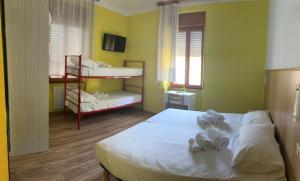 Postel nebo postele na pokoji v ubytování Hotel Garden