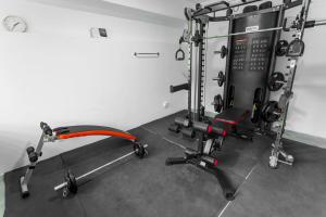 a room with a gym with a squatting machine at Villa 98 in Kandy