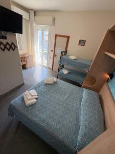Postel nebo postele na pokoji v ubytování Hotel Colibri B&B