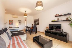 a living room with a couch and a table at C02 - Luxury 3 Bed with Pool View in Lagos +30 photos