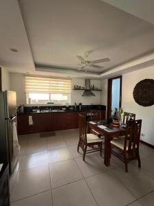 a kitchen and dining room with a table and chairs at Luxuary 1 Bedroom Apartment Pool and Sea view in Dauin in Dauin