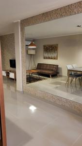 a living room with a couch and a table at Comfortable New Family House in Manta