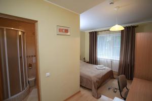 Postel nebo postele na pokoji v ubytování Hotel Jerevan