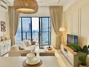 a living room with a view of a city at Trion KL 10mins to KLCC-Lalaport-Velocity 6 Pax in Kuala Lumpur