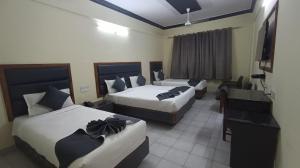 Ένα ή περισσότερα κρεβάτια σε δωμάτιο στο Hotel Ranjit Residency +37 φωτογραφίες