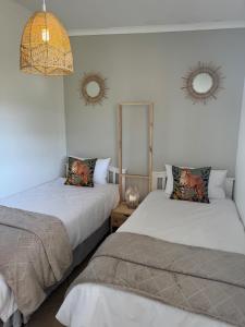 En eller flere senge i et værelse på Cadle Craft Cottage