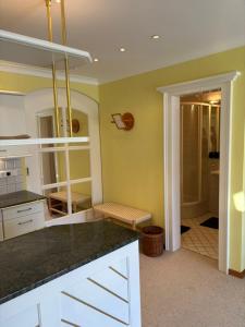 a kitchen with yellow walls and a counter top at Bergblick in Kitzbühel