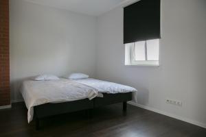 Postel nebo postele na pokoji v ubytování Pärnu Lubja Apartments